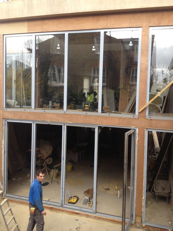 Aluminium bi-fold doors with two-storey glazing in Tottenham