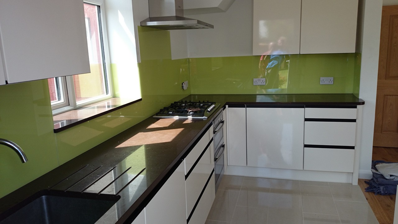 Lime green glass kitchen splashback installed by Tottenham glaziers