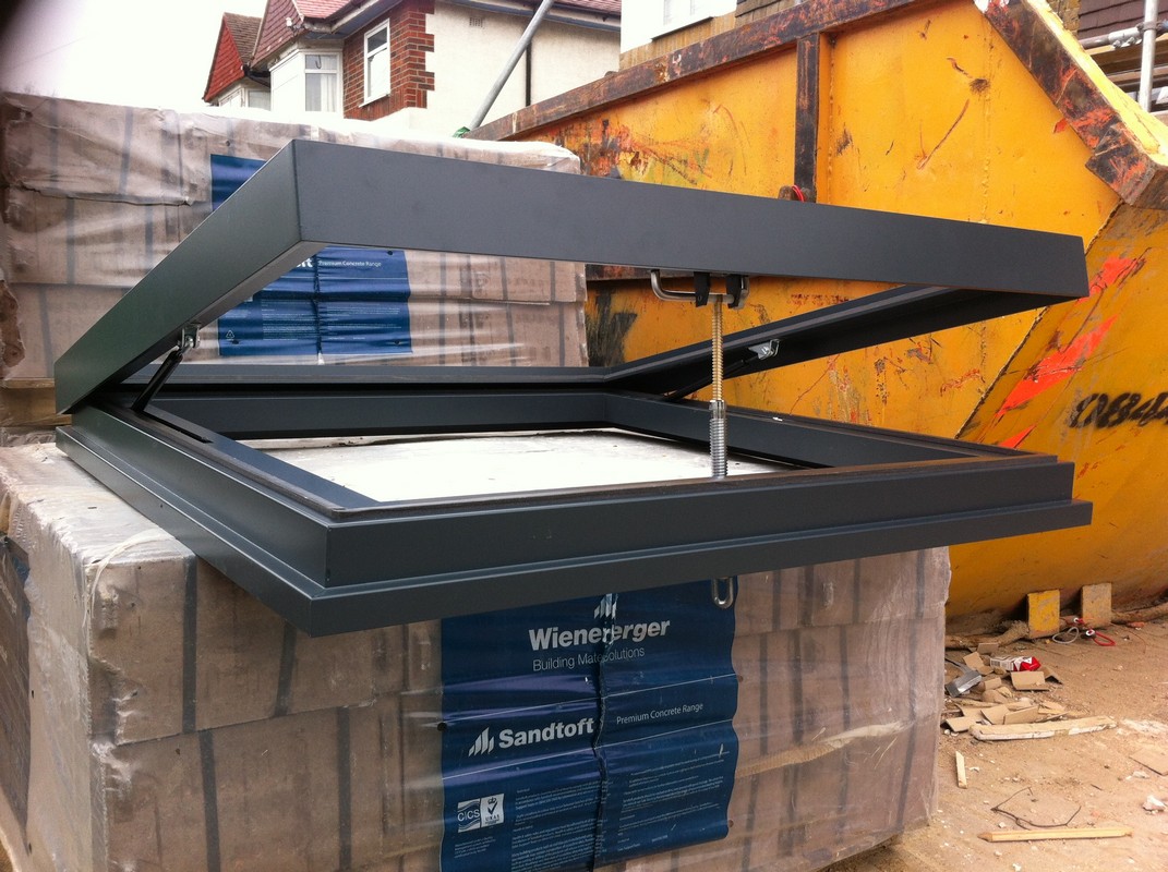 Opening flat roof skylight in anthracite grey installed in Tottenham